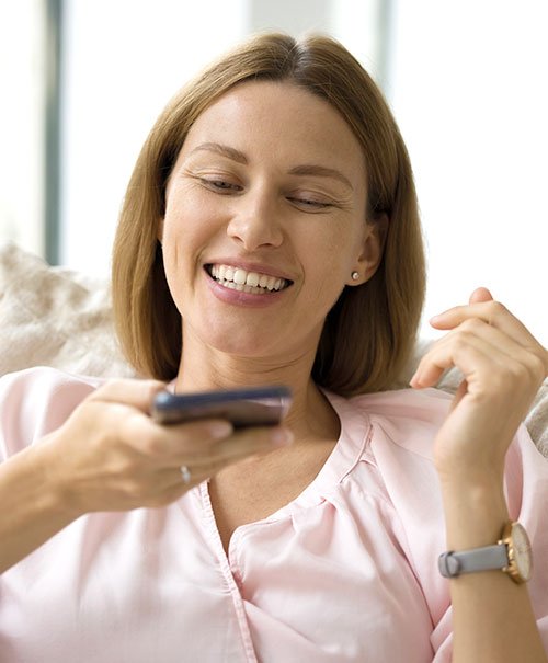 Woman-Speaking-into-Phone Content writing burnout solutions for entrepreneurs