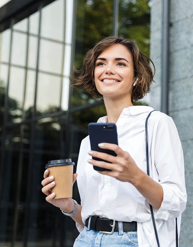Business-Woman-Showing-up-with-Confidence-Look-Left-Portrait Woman in business enjoying ease and clarity – outcome of Owl Luminous support services.