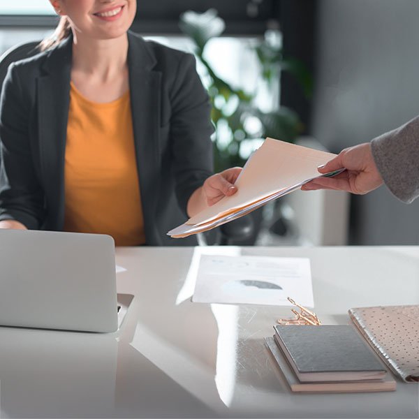 Photo symbolising the handover of branding files from designer to business owner